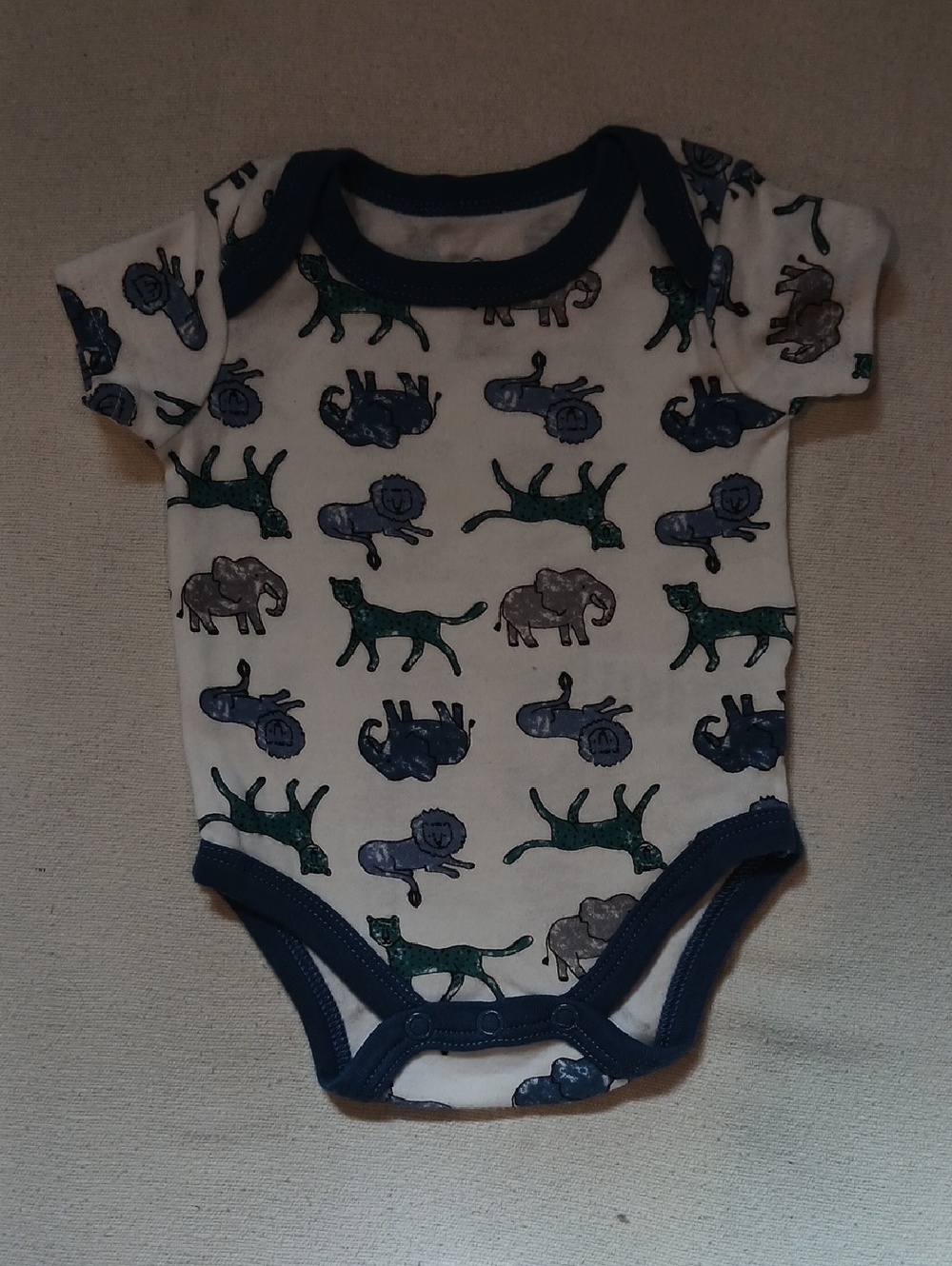 Short-Sleeve White Baby Bodysuit with Blue Trim and Animal Print